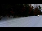 3 Snowmobiles heading down the trail in Michigan